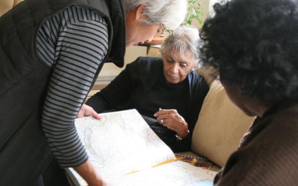 Multisector Plans women looking at map
