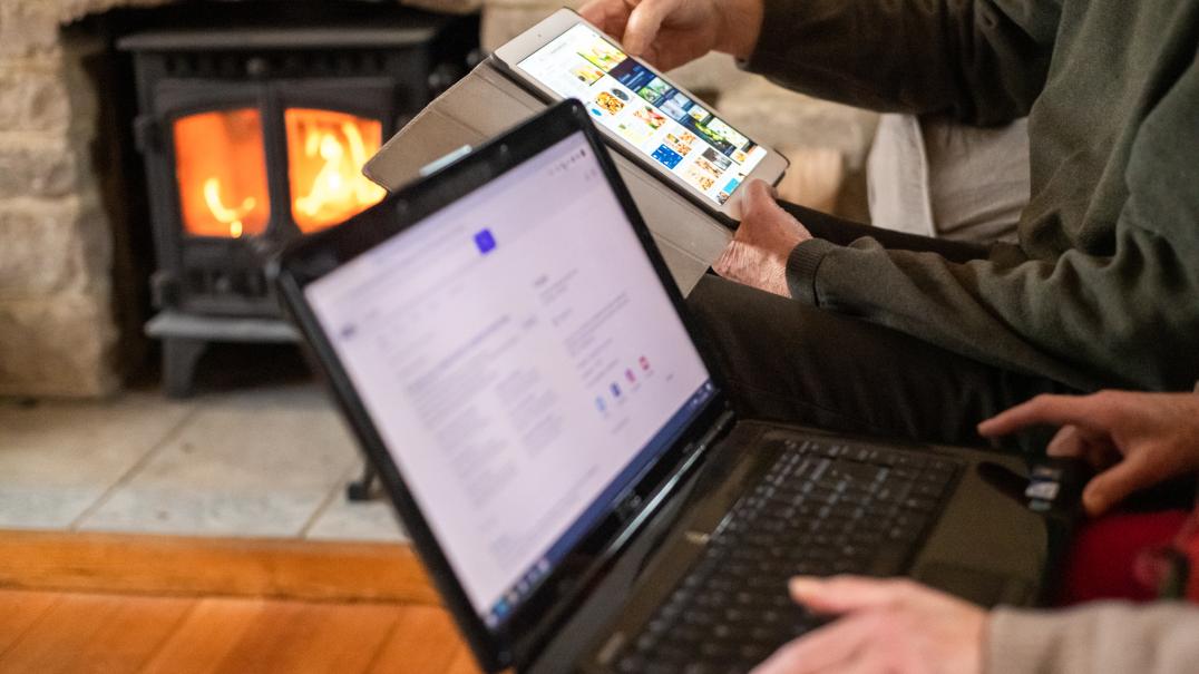 man and woman hands on computers