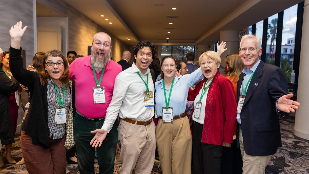 group of members smiling at the conference