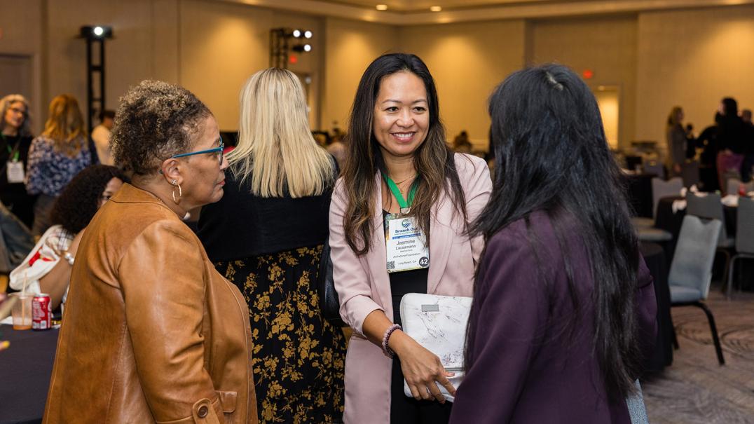 three gia members talking after conference session