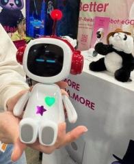 mini white robot in a human hand