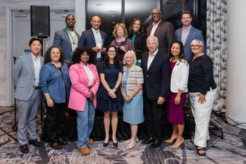 group of people standing and smiling