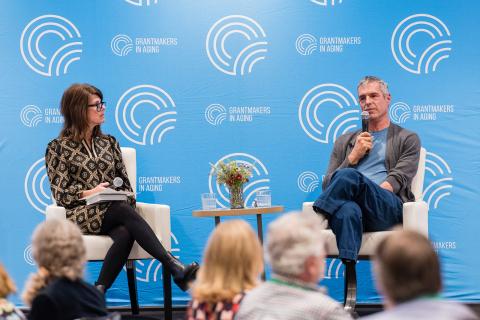 two people sitting on the gia stage