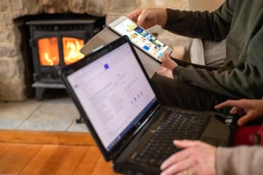 man and woman hands on computers