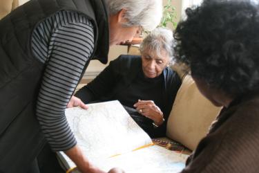 Multisector Plans women looking at map