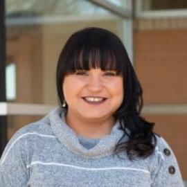 woman with dark long hair and bangs